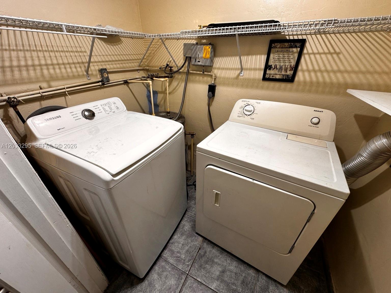 A laundry room features a Samsung washing machine, an Admiral dryer, and wire shelving — 17215 SW 112 CT, Miami FL 33157, MIAMI, FL