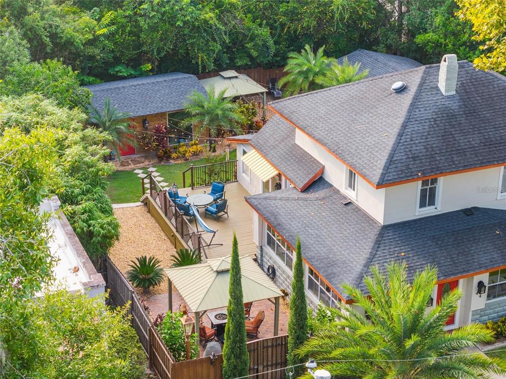 An aerial view shows a house with a wooden deck, two gazebos, and a backyard — 44 SE 9TH TERRACE, OCALA, FL