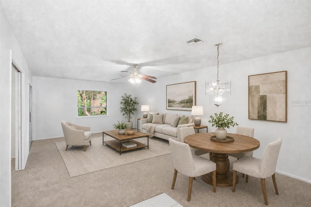 This is a digitally staged living and dining room with neutral furniture and carpeted floors — 520 WINDMEADOWS STREET UNIT 520, ALTAMONTE SPRINGS, FL