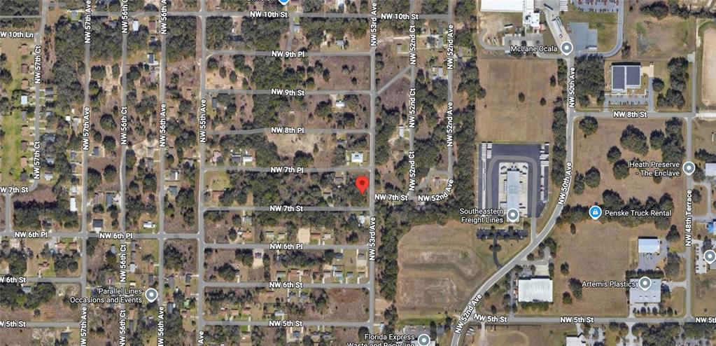This is an aerial map view showing a residential area with a red location pin — 5311 NW 7TH STREET, OCALA, FL