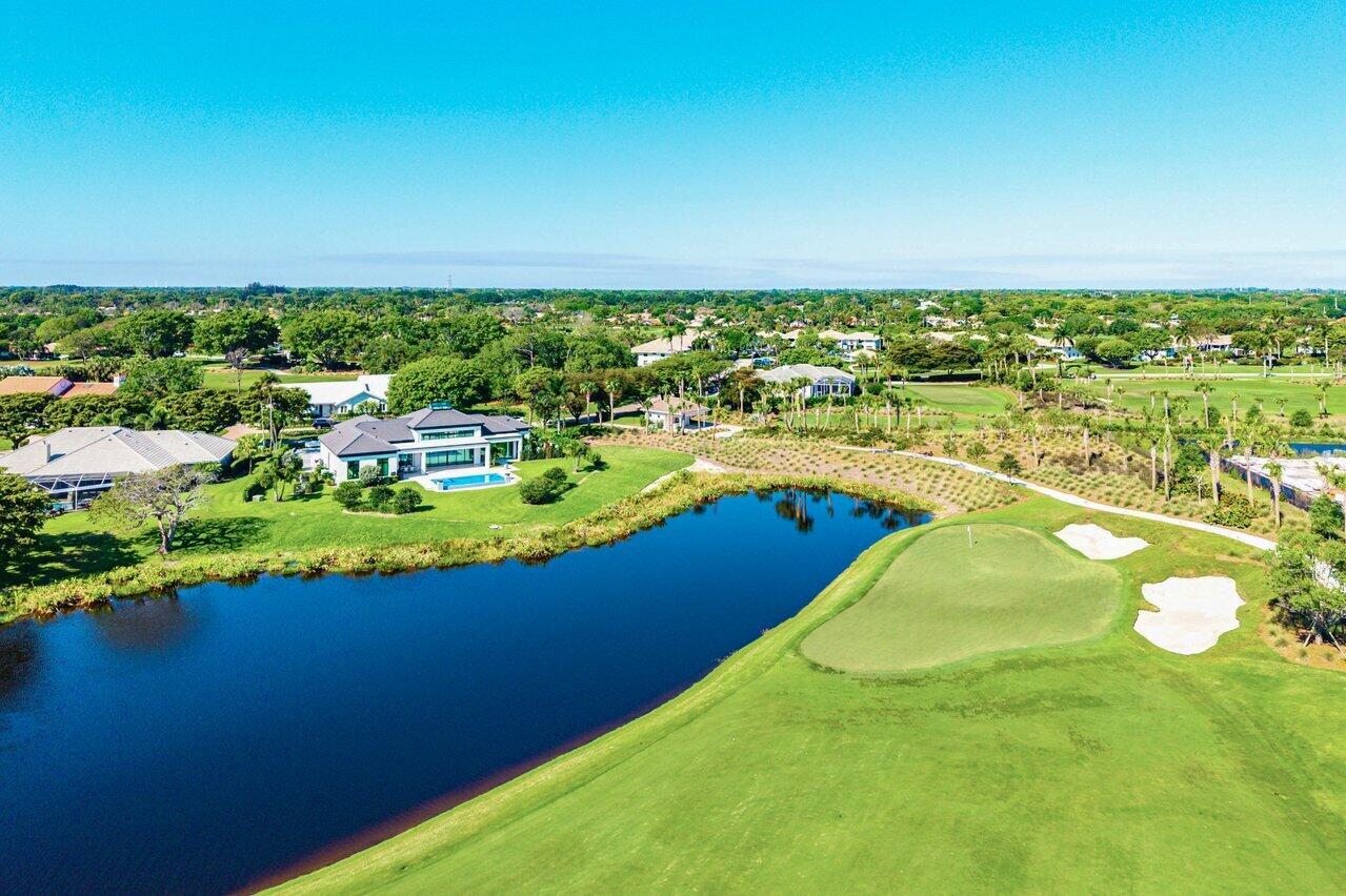 An aerial view of a modern house situated beside a golf course and a lake — 4249 N Quail Ridge Dr Drive # A, Boynton Beach FL 33436, BOYNTON BEACH, FL