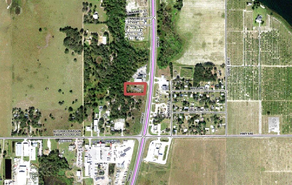 This is an aerial map showing a highlighted property lot located near a highway intersection — S US HIGHWAY 27, LAKE WALES, FL