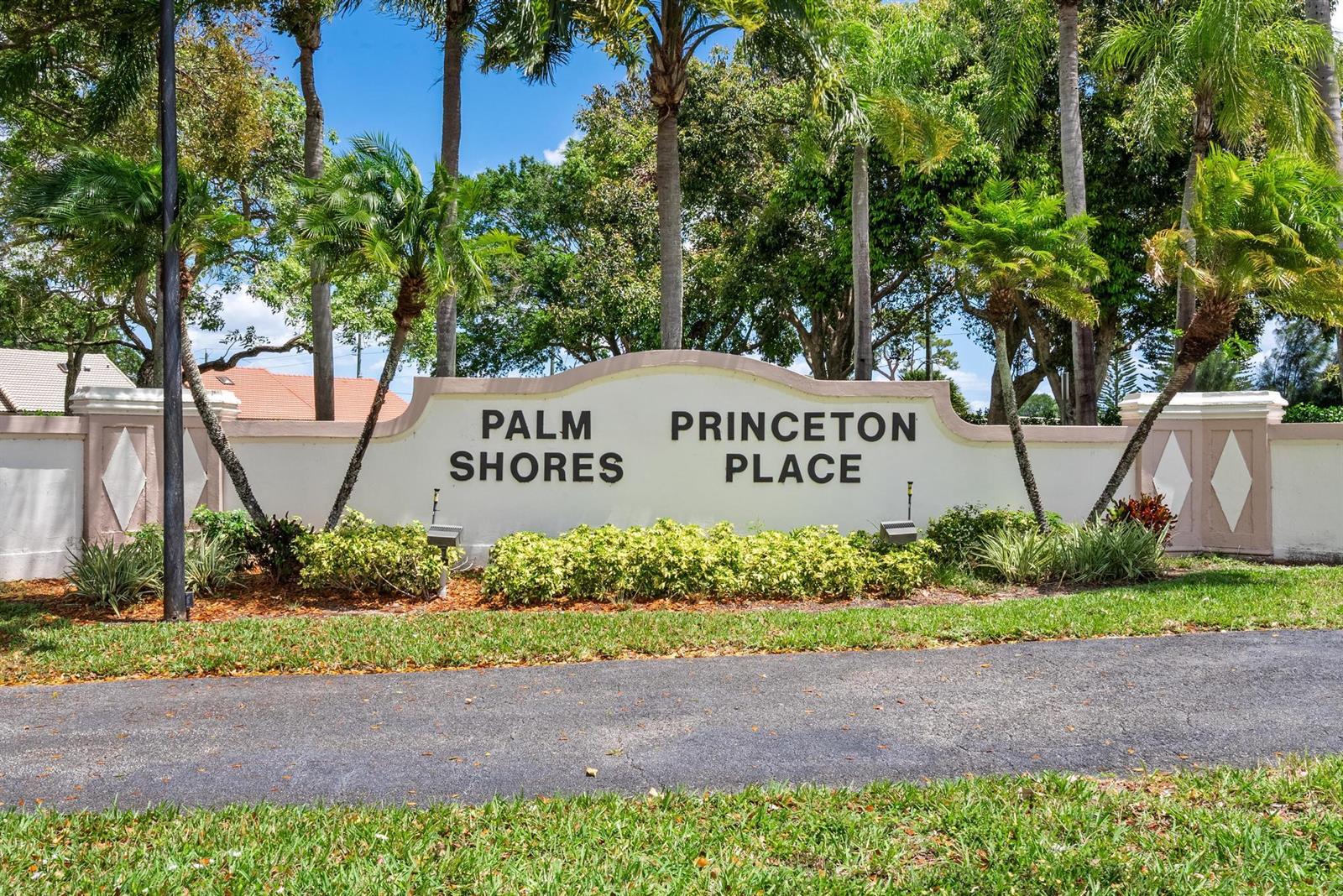 A beige community entrance sign with the text Palm Shores Princeton Place stands outdoors — 8521 Leeway Lane, Boynton Beach FL 33436, BOYNTON BEACH, FL