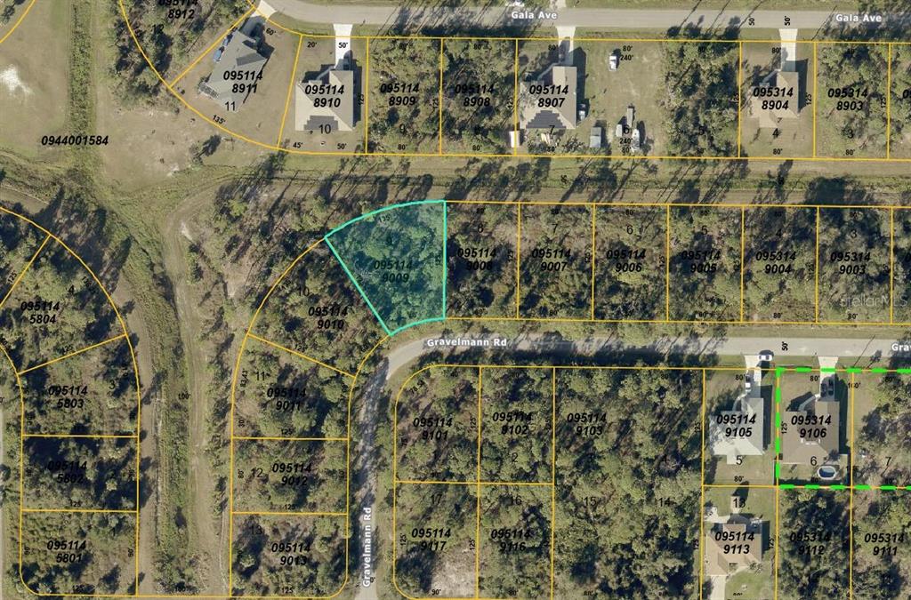 This is an aerial map showing residential lots and street layouts in a wooded area — GRAVELMANN ROAD, NORTH PORT, FL