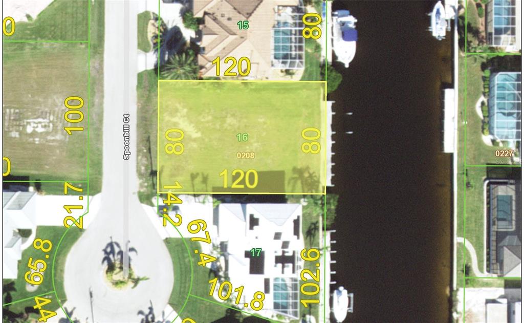 This is a property map showing a rectangular waterfront lot with dimensions labeled in feet — 3754 SPOONBILL COURT, PUNTA GORDA, FL
