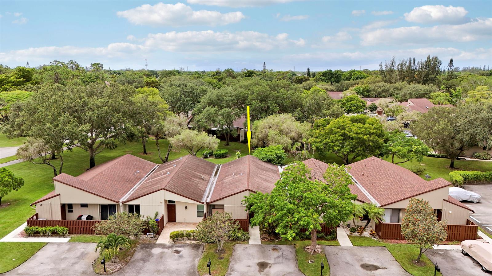 An aerial view shows a row of attached single-story townhouses with brown shingled roofs — 11606 Orange Blossom Lane, Boca Raton FL 33428, BOCA RATON, FL