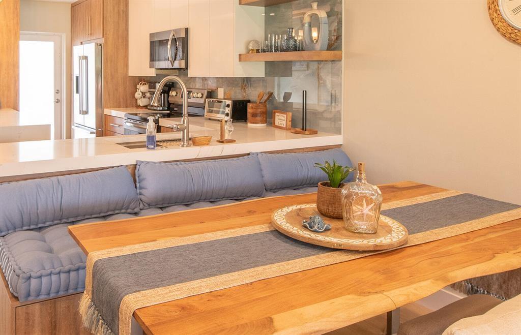 A modern kitchen sink with a roll-up drying rack sits in a white marble countertop — 101 NE 19th Avenue # 126, Deerfield Beach FL 33441, DEERFIELD BEACH, FL