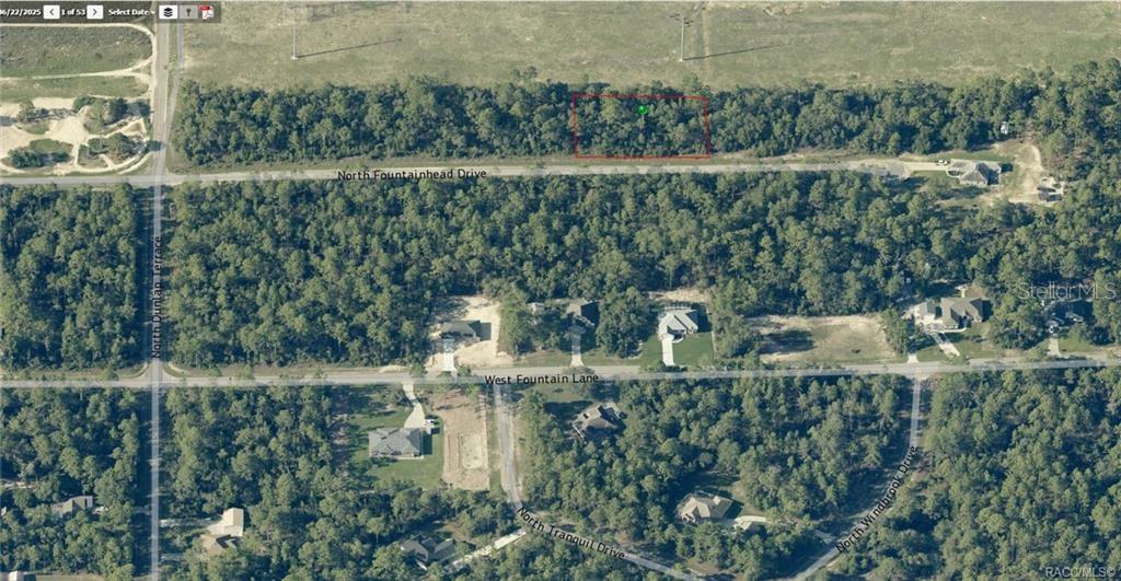 An aerial view shows a rectangular plot of land outlined in red within a wooded area — 6925 N FOUNTAINHEAD DRIVE, CITRUS SPRINGS, FL