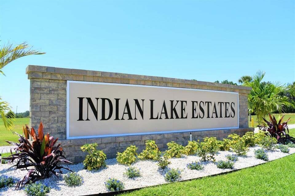 A stone monument sign with the text Indian Lake Estates sits in a landscaped garden — Tbd Azalea Drive, FL 33855, FL