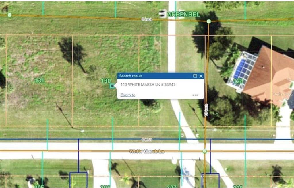 This is a map showing a vacant residential lot located between two existing properties — 113 WHITE MARSH LANE, ROTONDA WEST, FL