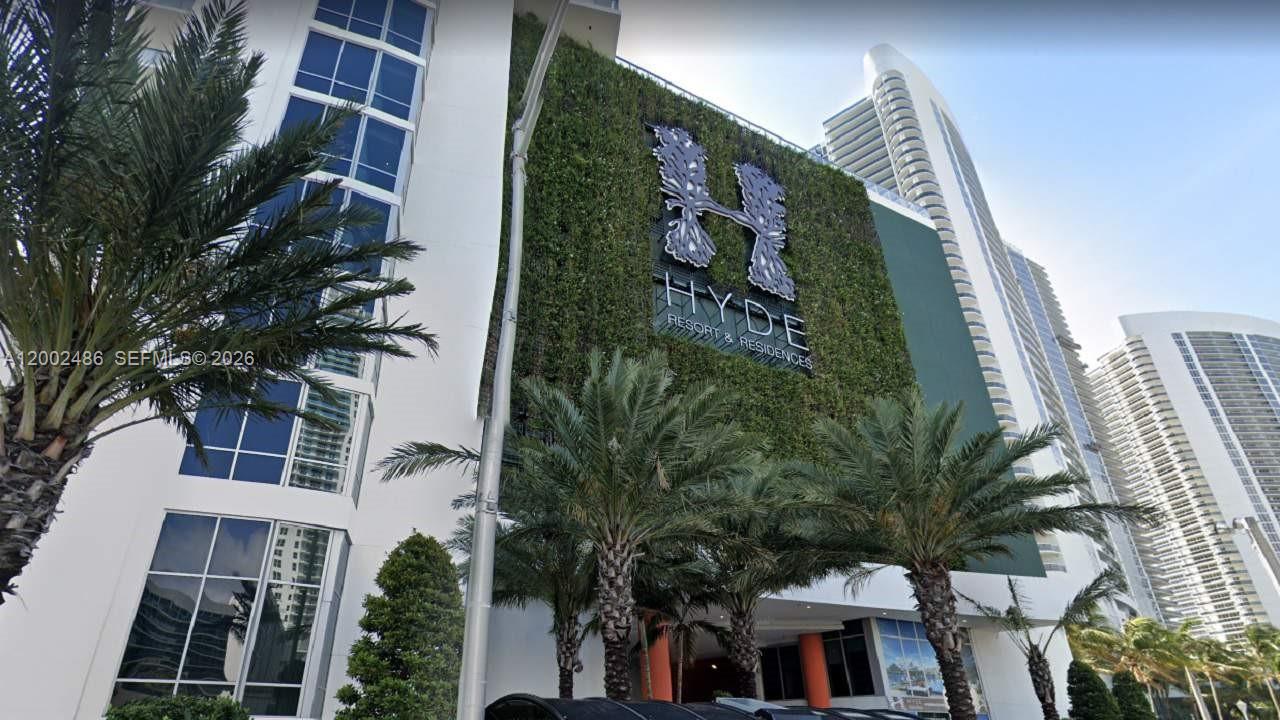 Exterior view of the Hyde Resort and Residences building featuring a large green wall — 4111 S Ocean Dr # 1002, Hollywood FL 33019, HOLLYWOOD, FL
