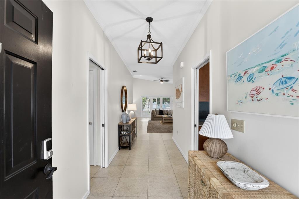 A tiled entryway leads into a living area with a dark metal lantern light fixture — 1741 MIZELL AVENUE, WINTER PARK, FL