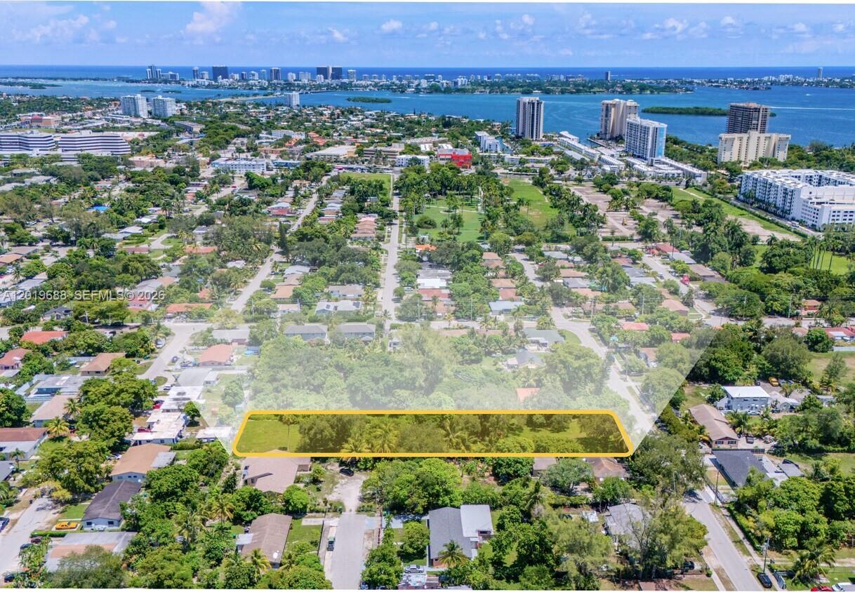 An aerial view shows a rectangular vacant lot highlighted in yellow within a residential neighborhood — 1231 NE 115th St, Miami FL 33161, MIAMI, FL