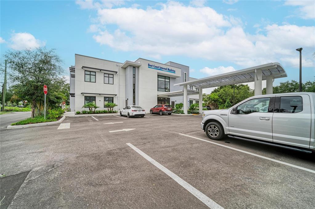 A two-story medical office building with a parking lot and a covered drop-off area — 201 5TH AVENUE DRIVE E, BRADENTON, FL