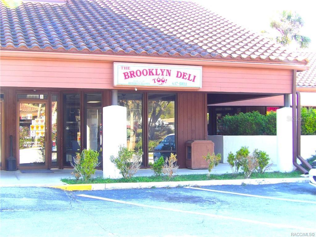 The exterior of a commercial building features a sign for The Brooklyn Deli Too — 3360 E GULF TO LAKE HIGHWAY, INVERNESS, FL