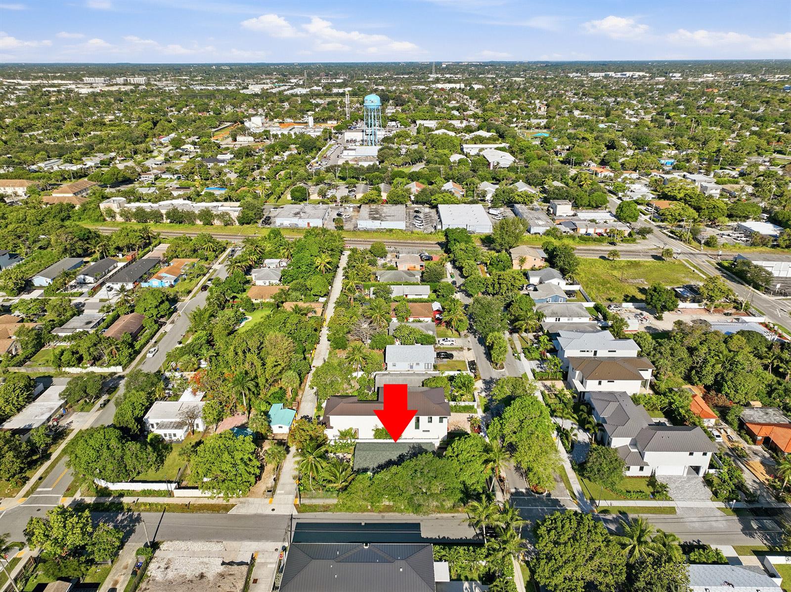 An aerial view shows a residential neighborhood with a red arrow pointing to a house — 502 SE 3rd Avenue, Delray Beach FL 33483, DELRAY BEACH, FL