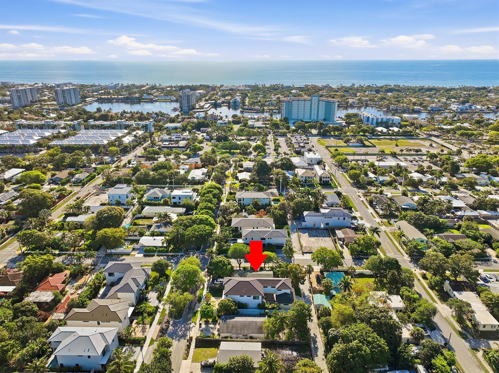 An aerial view shows a residential neighborhood with a red arrow pointing to a house — 502 SE 3rd Avenue, Delray Beach FL 33483, DELRAY BEACH, FL