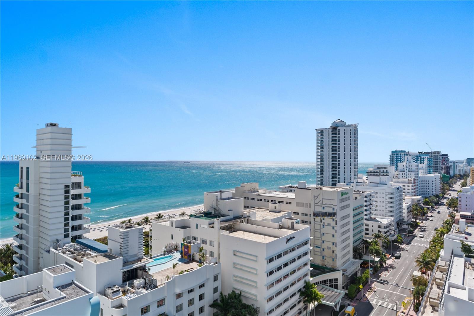 An elevated view of a coastal city with high-rise buildings, a beach, and the ocean — 4401 Collins Ave # 1706, Miami Beach FL 33140, MIAMI BEACH, FL