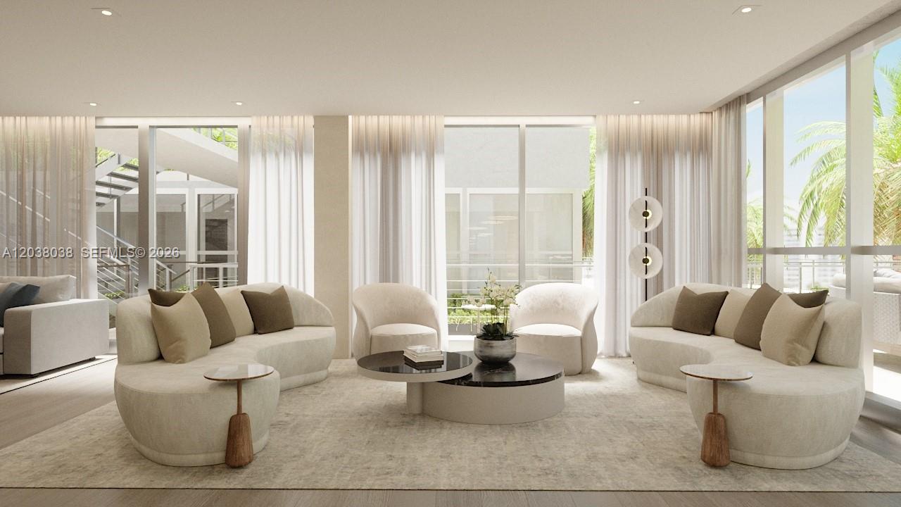 This is a rendering of a modern living room featuring curved sofas and floor-to-ceiling windows — 250 Collins Ave # 305, Miami Beach FL 33139, MIAMI BEACH, FL