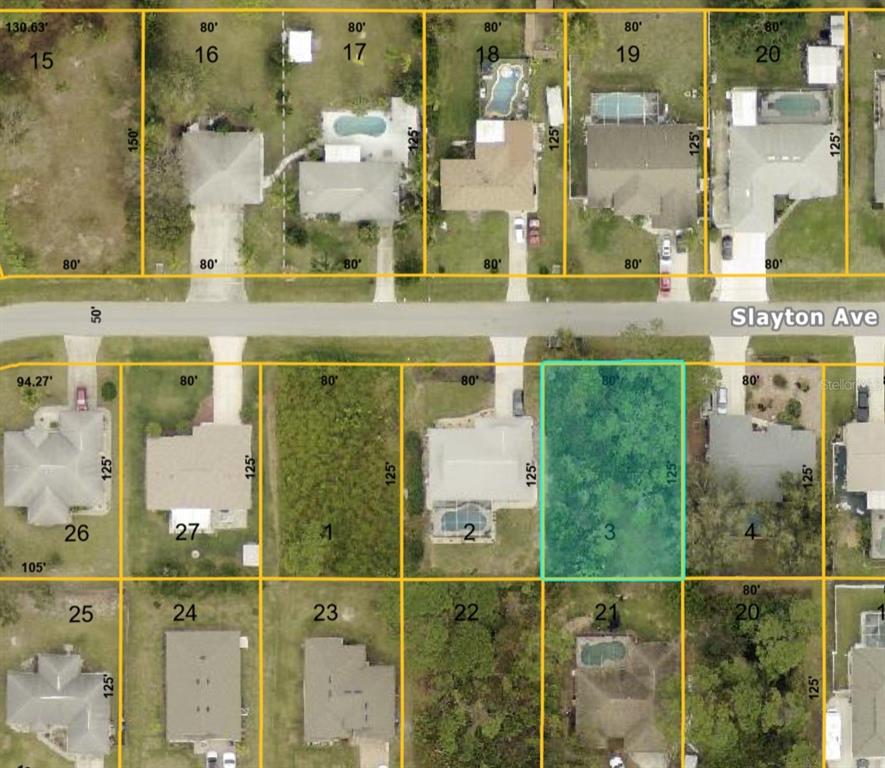 This is a satellite map showing residential lots and houses along a street — SLAYTON AVENUE, NORTH PORT, FL