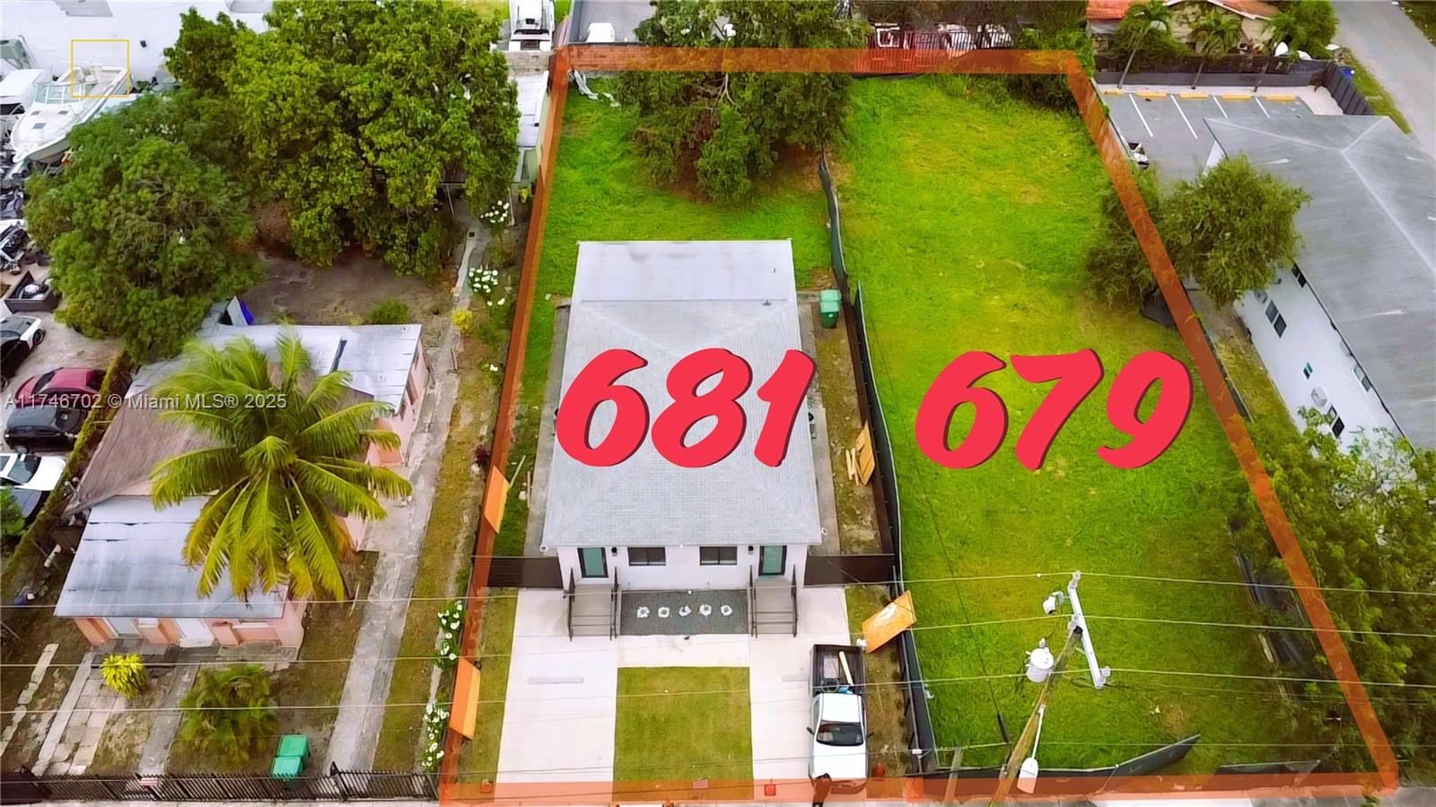 An aerial view shows a house and an adjacent vacant lot outlined in orange — 679 NW 30th St, Miami FL 33127, MIAMI, FL