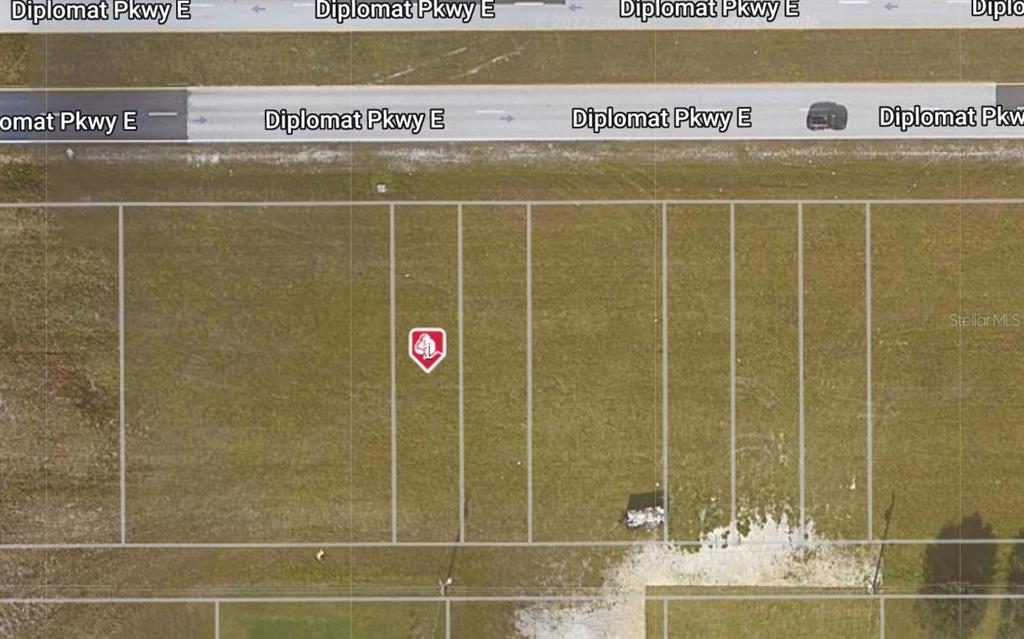 This is an aerial map view of several vacant residential lots along a road — 1936 DIPLOMAT PARKWAY E, CAPE CORAL, FL