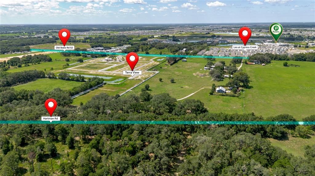 This aerial map shows a residential development site with labeled roads and nearby landmarks — 31641 COUNTY ROAD 52, SAN ANTONIO, FL