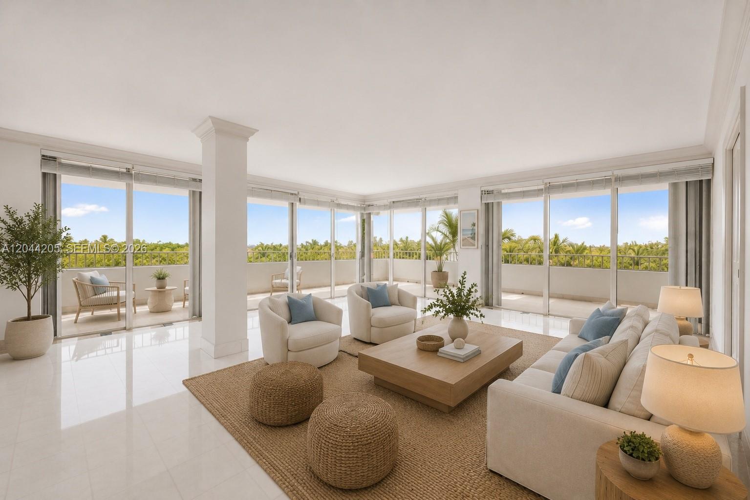 A bright living room features white tile floors, floor-to-ceiling windows, and a balcony with greenery — 155 Ocean Lane Dr # 600, Key Biscayne FL 33149, KEY BISCAYNE, FL