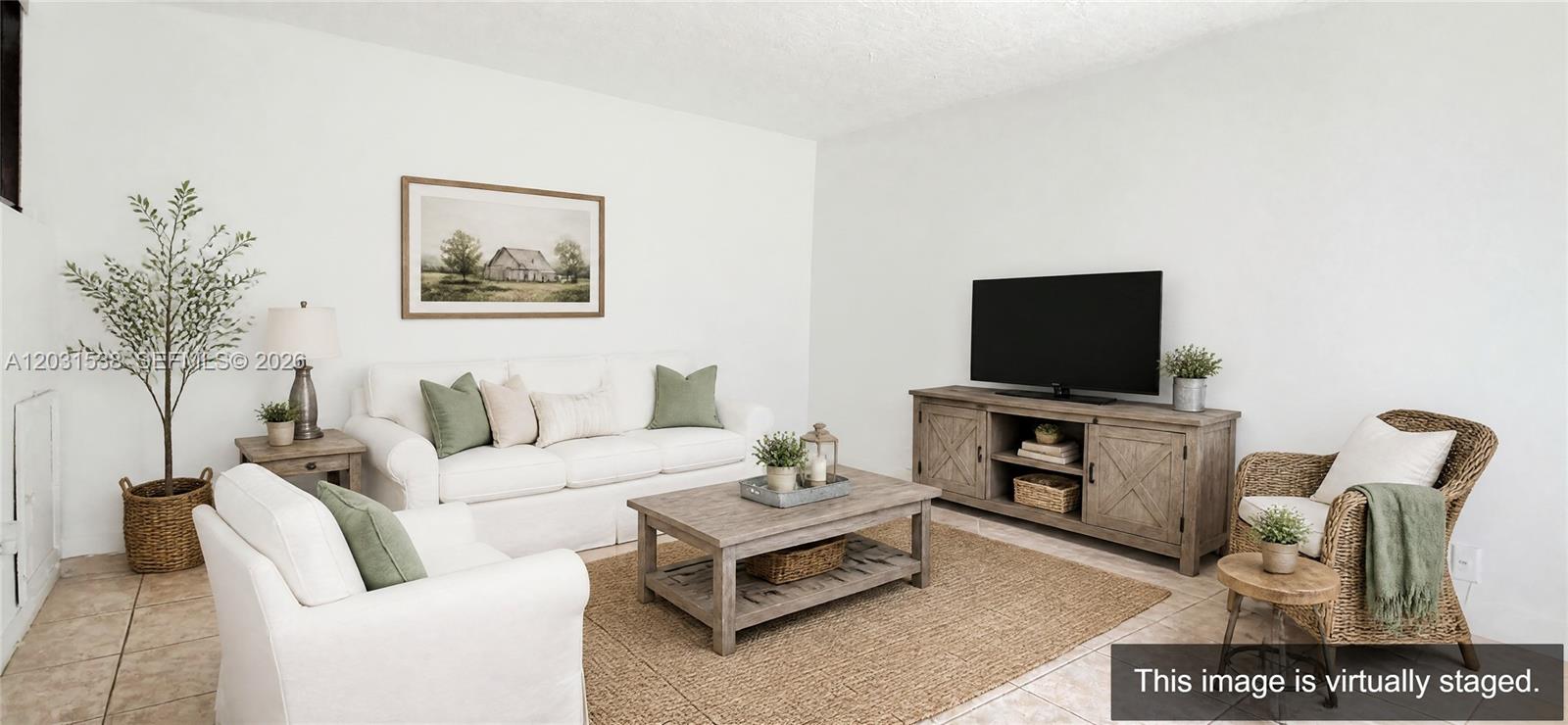 This virtually staged living room features white walls, tile flooring, and rustic wooden furniture — 608 Commodore Dr, Plantation FL 33325, PLANTATION, FL