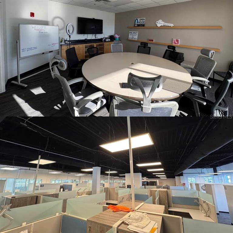 This image shows a conference room with a round table and an open-plan office space — 8701 MAITLAND SUMMIT BOULEVARD UNIT Breezeway Suite 1, ORLANDO, FL