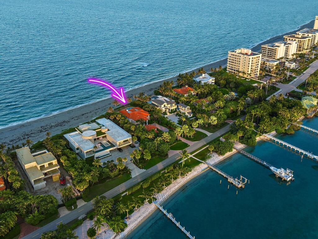 An aerial view shows a beachfront house with a red tile roof and a pool — 613 S Beach Road, Jupiter FL 33469, JUPITER, FL