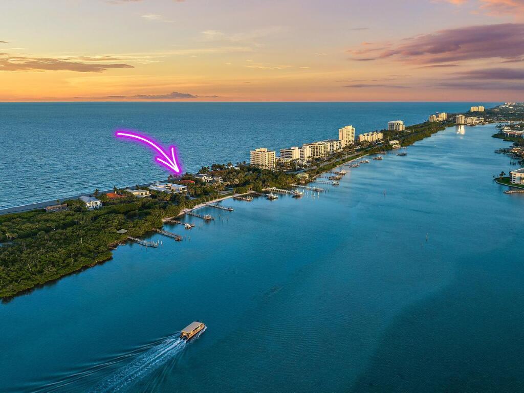 An aerial view shows a narrow coastal strip of land between the ocean and bay — 613 S Beach Road, Jupiter FL 33469, JUPITER, FL