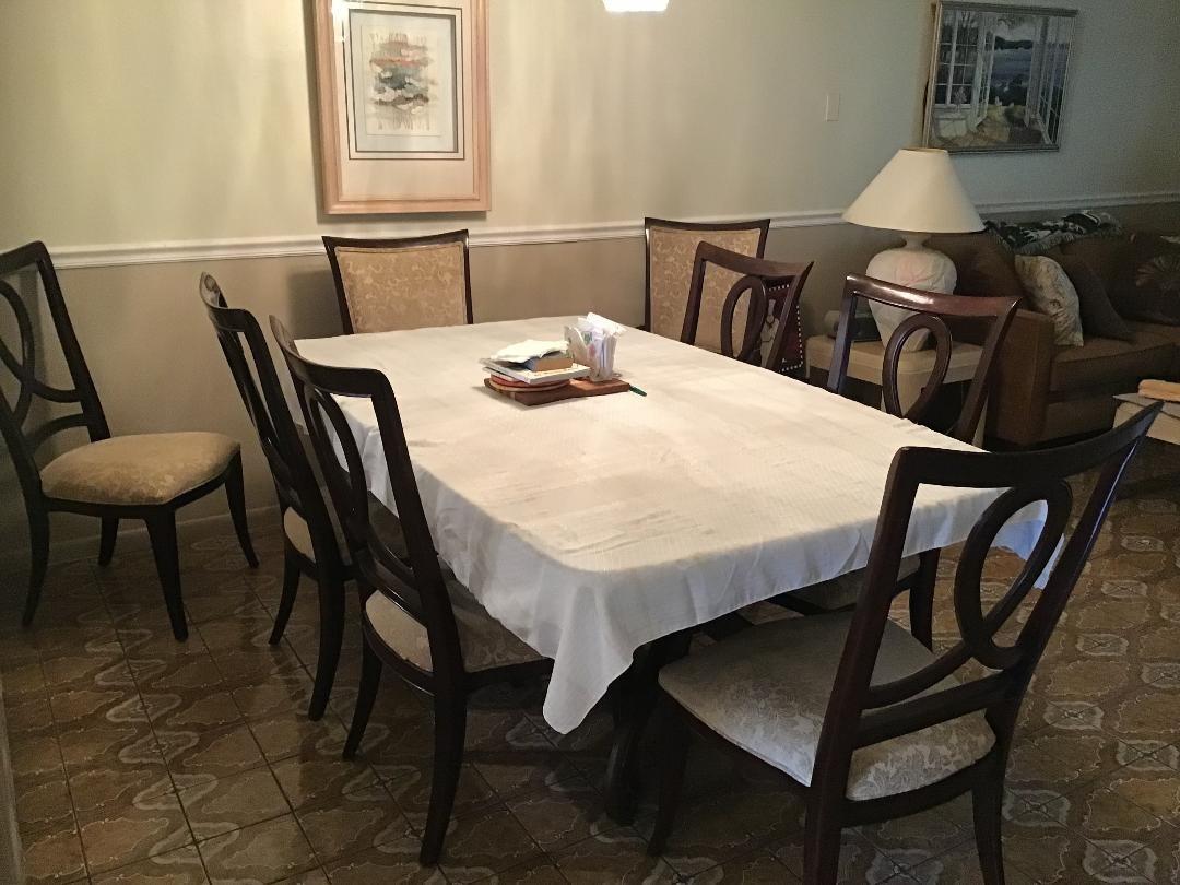 A dining room features a table with a white tablecloth, six chairs, and tiled flooring — 7410 NW 1st Street # 202, Margate FL 33063, MARGATE, FL