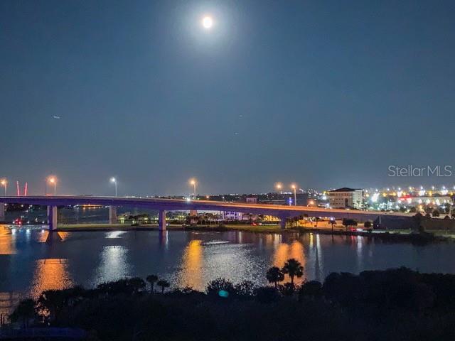 A bridge spans a body of water under a full moon at night — 231 RIVERSIDE DRIVE UNIT 709-1, DAYTONA BEACH, FL