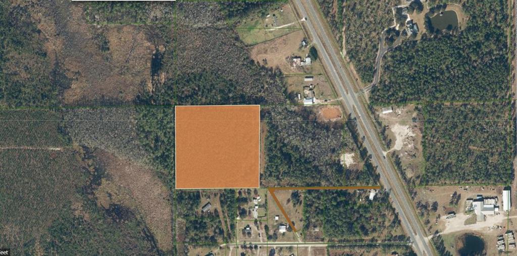 An aerial map view shows a highlighted square parcel of land near a highway — 00 UNASSIGNED LOCATION RE, PALATKA, FL