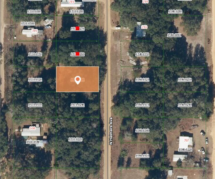 This is a satellite map view showing a highlighted rectangular plot of land — 0 N Helmers Avenue, FL 32148, FL