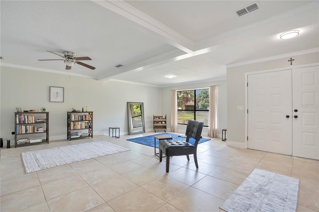 An entryway features white double doors, light tile flooring, and a view of the outdoors — 2724 ARDON AVENUE, ORLANDO, FL