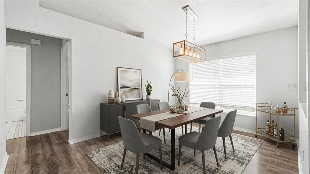 A dining room features a wooden table, six gray chairs, a sideboard, and a chandelier — 56 HEMLOCK RADIAL, OCALA, FL