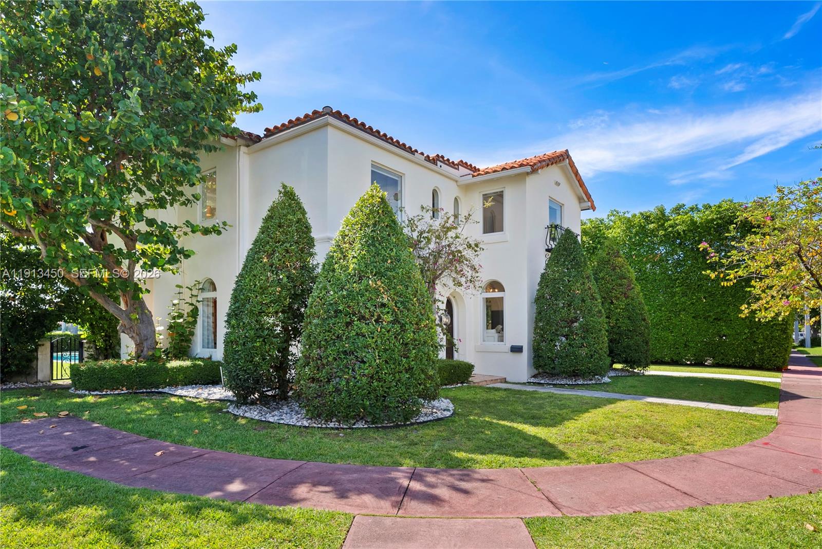 A two-story stucco house with a red tile roof and manicured landscaping — 5800 La Gorce Dr, Miami Beach FL 33140, MIAMI BEACH, FL