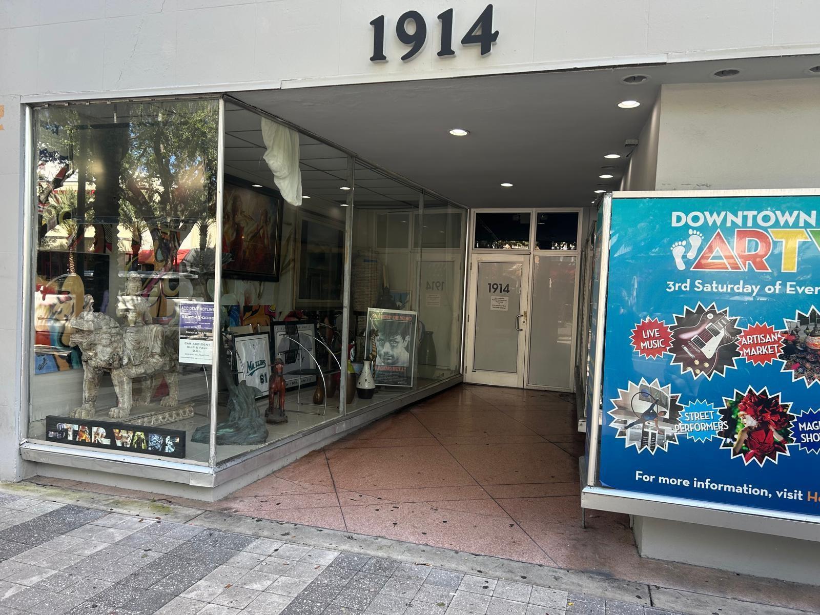 An exterior view of a storefront entrance with a large display window and signage — 1914 Hollywood Boulevard, Hollywood FL 33020, HOLLYWOOD, FL