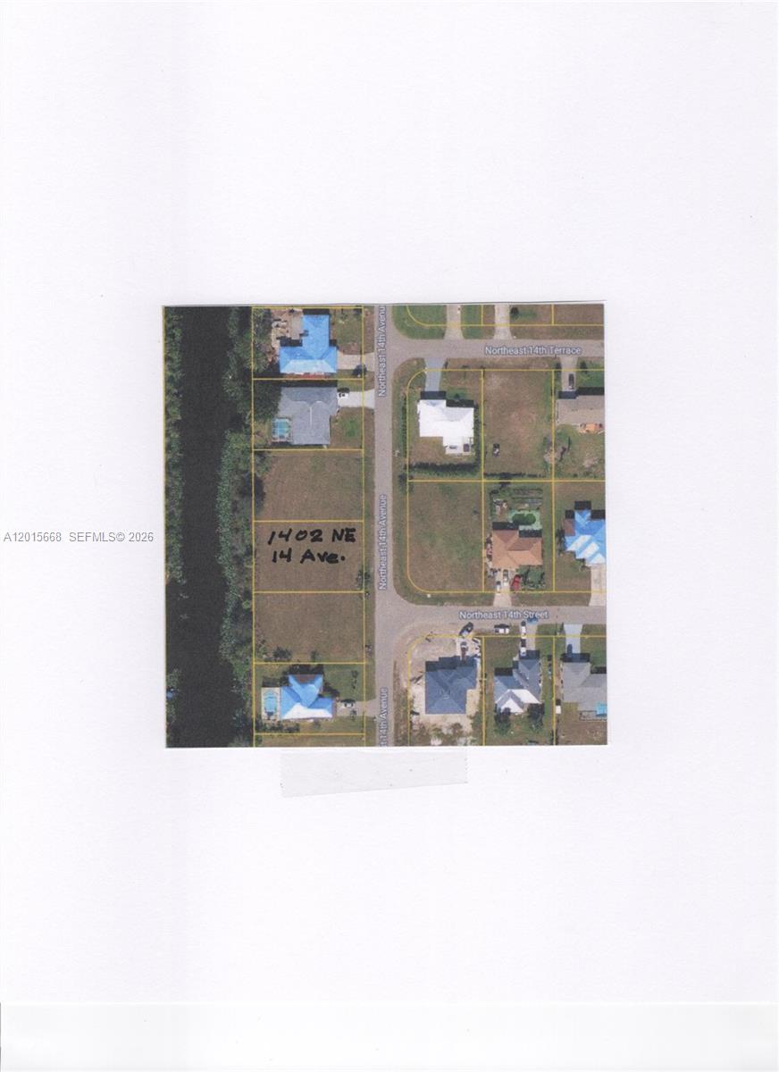 This is an aerial map showing a vacant residential lot located on a street corner — 1402 NE 14 ave, Cape Coral FL 33909, CAPE CORAL, FL