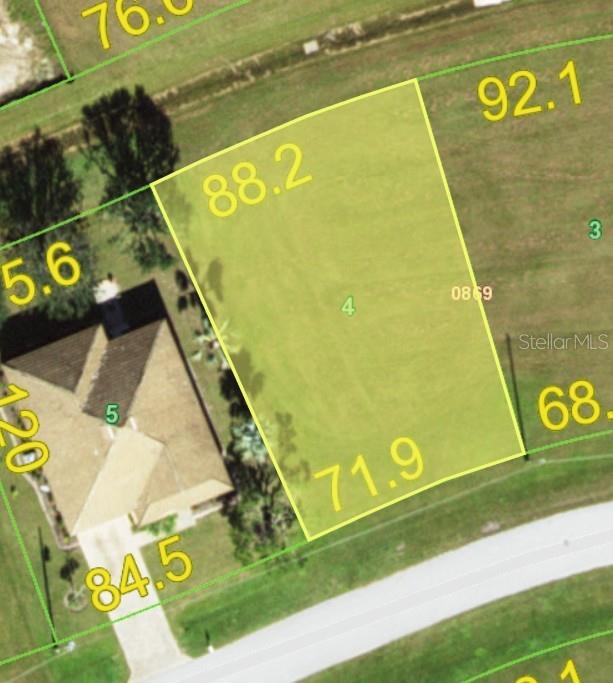 An aerial map view shows a highlighted vacant residential lot labeled with the number four — 24473 MANIZALES COURT, PUNTA GORDA, FL