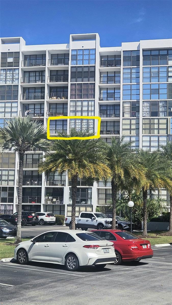 Exterior view of a multi-story apartment building with a yellow box highlighting a balcony — 1000 Parkview Dr # 605, Hallandale Beach FL 33009, HALLANDALE BEACH, FL