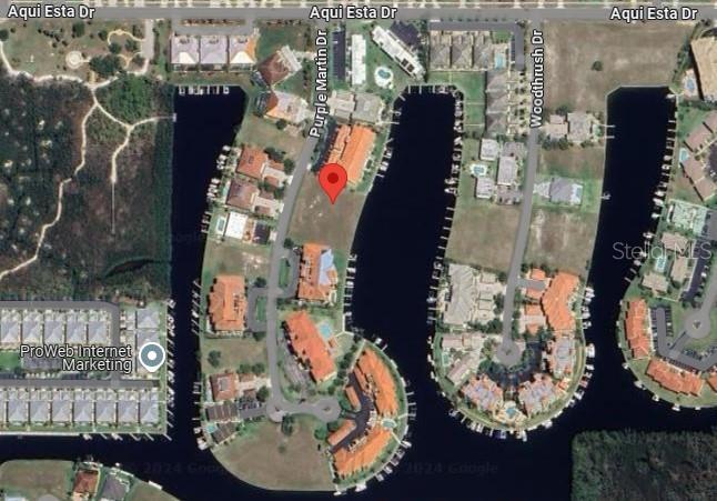 This is an aerial map view of a residential waterfront community with multiple buildings — 3232 PURPLE MARTIN DRIVE, PUNTA GORDA, FL