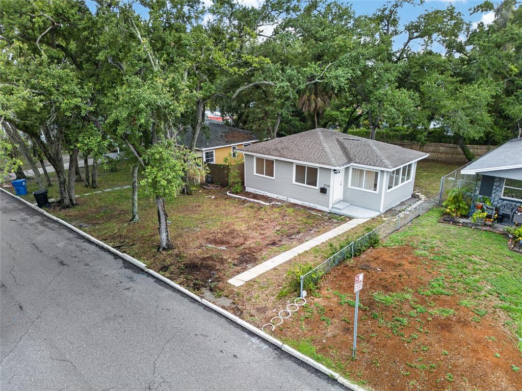 An elevated view shows a gray house with a brown roof and a front yard — 2525 21ST STREET S, ST PETERSBURG, FL