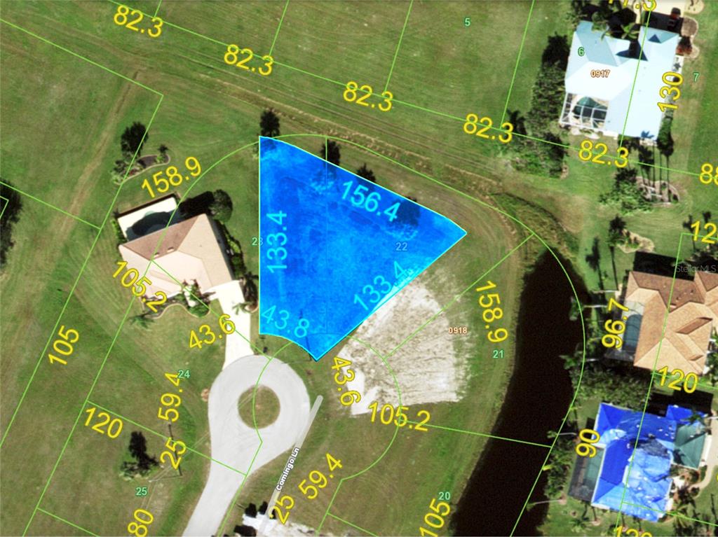 This is a property map showing a highlighted vacant lot in a residential neighborhood — 17262 COMINGO LANE, PUNTA GORDA, FL