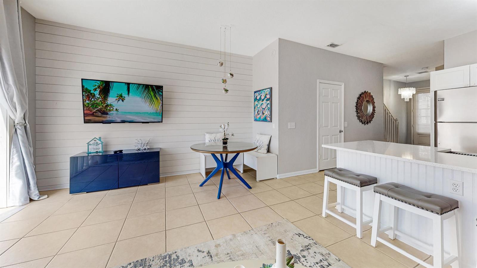 A dining area and kitchen island are visible in this open-concept living space — KISSIMMEE, FL