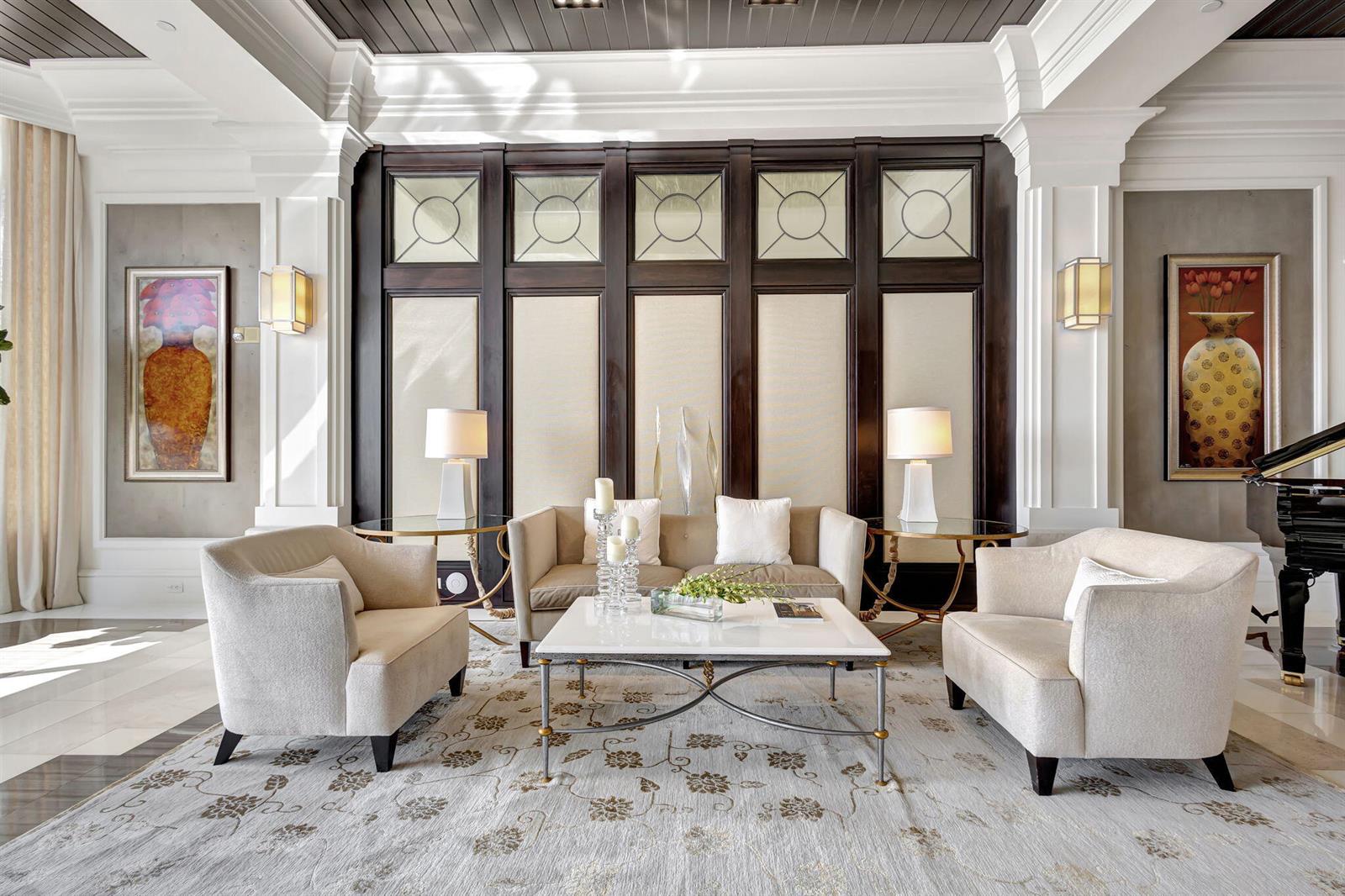 A formal living room features a sofa, two armchairs, a coffee table, and dark wood paneling — 2700 N Ocean Drive # 804a, Riviera Beach FL 33404, RIVIERA BEACH, FL