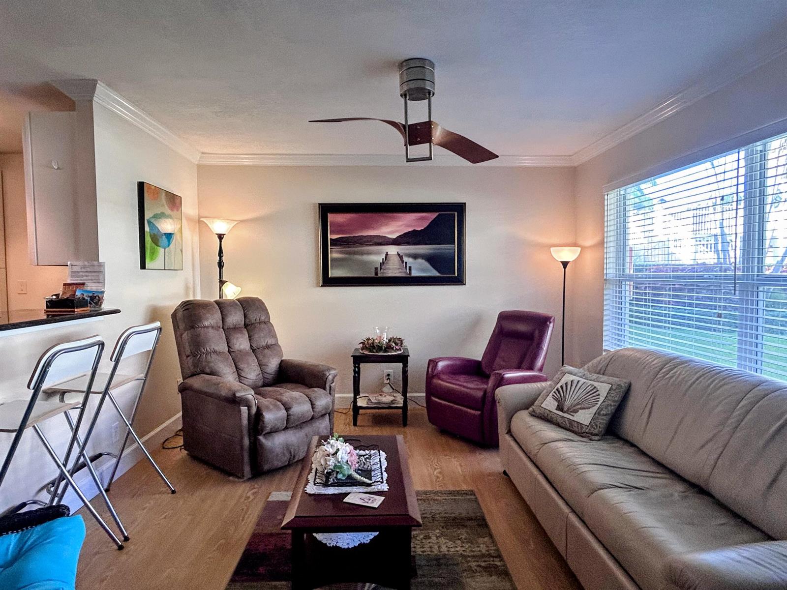 A living room features a brown recliner, a purple recliner, a sofa, and a ceiling fan — 638 Snug Harbor Drive # E6, Boynton Beach FL 33435, BOYNTON BEACH, FL