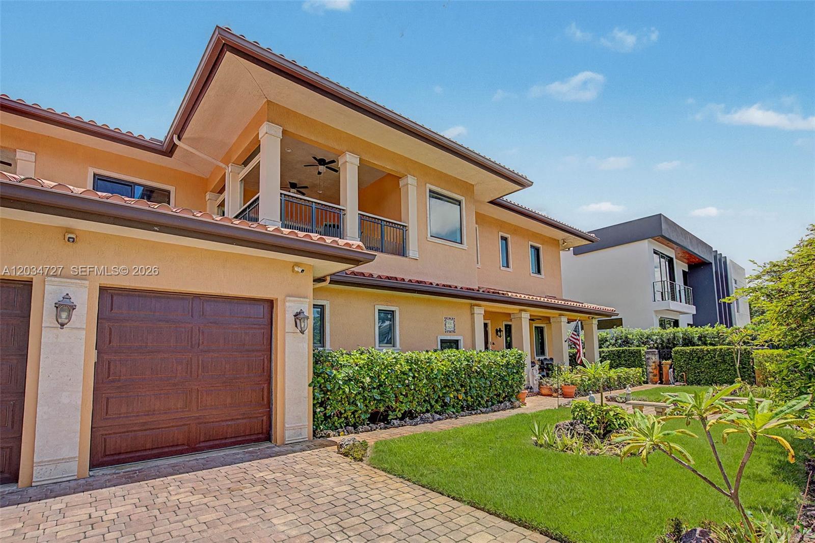 A two-story stucco house with a tile roof, a garage, and a front lawn — 4251 SW 11th St, Miami FL 33134, MIAMI, FL